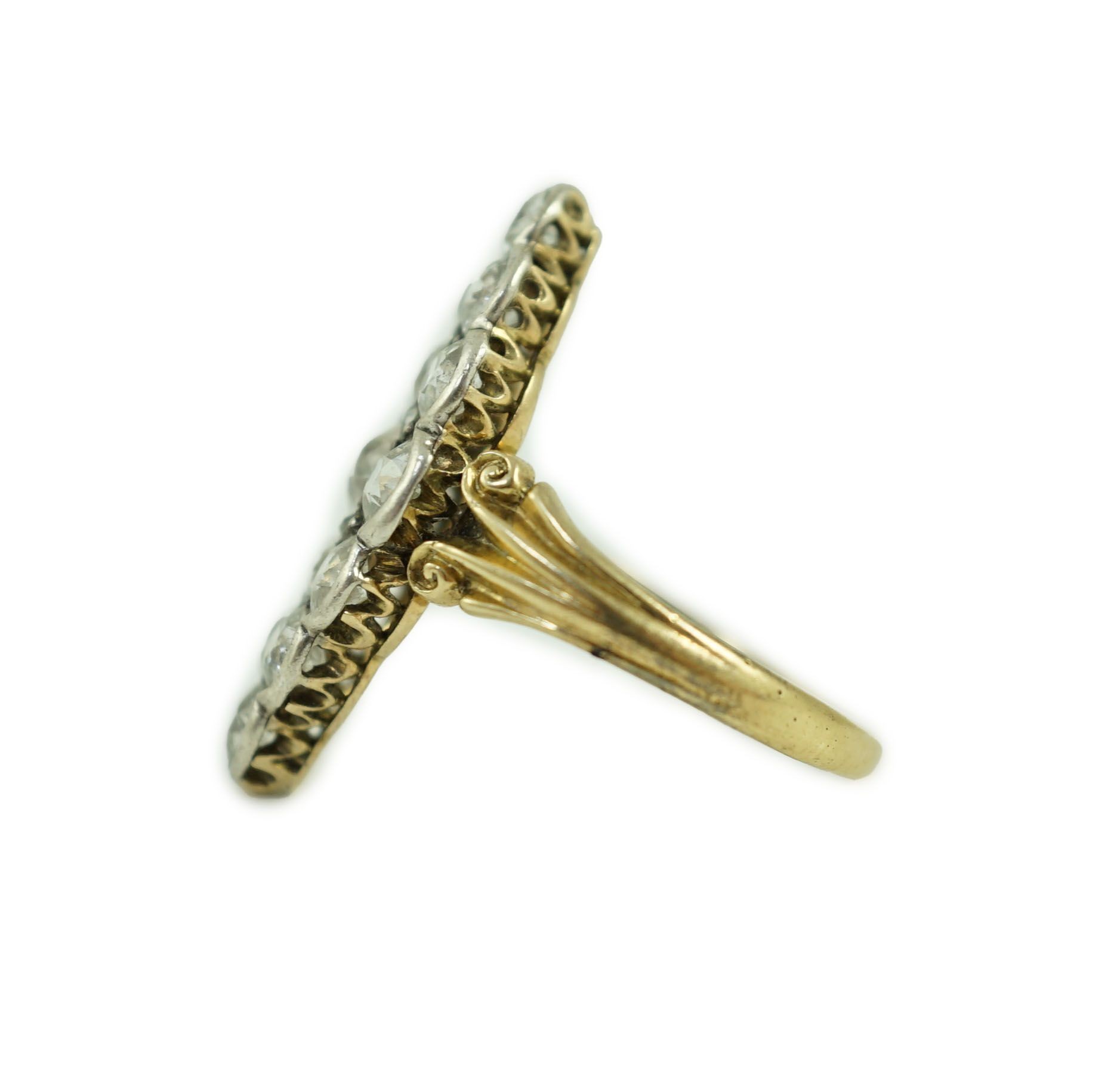 A Victorian style 18ct gold and fifteen stone diamond set marquise cluster dress ring